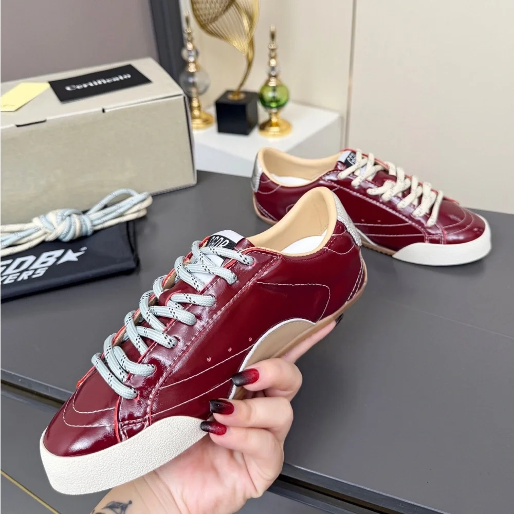 Golden Goose Women's Burgundy Leather Low-Top Sneakers with White Soles